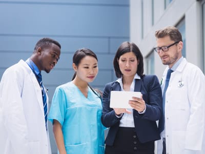 Urology care team reviewing patient information together, representing collaborative care