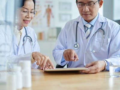 Urology providers reviewing patient information together